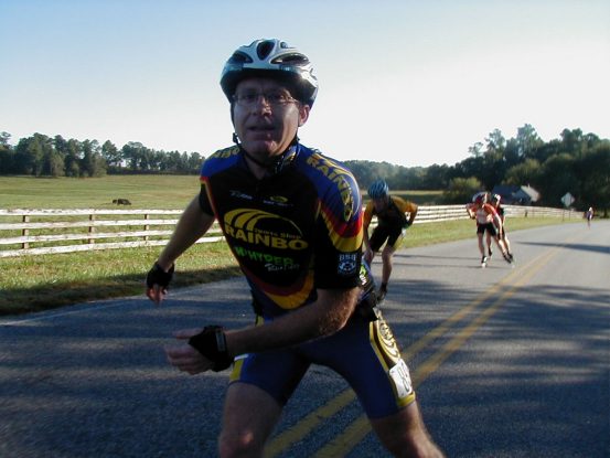 Tom easily moving uphill, after the pace line was chased by a pit bull pulling 10 yards of heavy chain. That dog easily ran 3 miles with us swinging that chain along the road; sometimes as close as 3 or 4 feet from us, twice cutting through the line to run on either side of the road. My what a competitor.