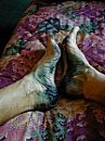 The only thing uglier than this bedspread is the black from my boots coming off on my feet.