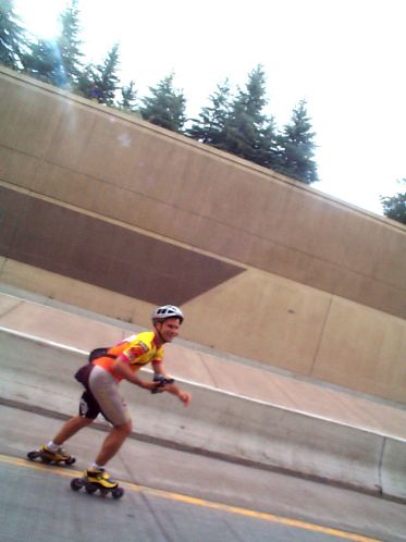Eddy after his race skating back up the course to encourage and photograph the later waves of skaters.