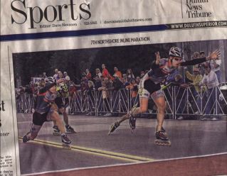Race leaders at the finish line on the Sports page in the local paper.